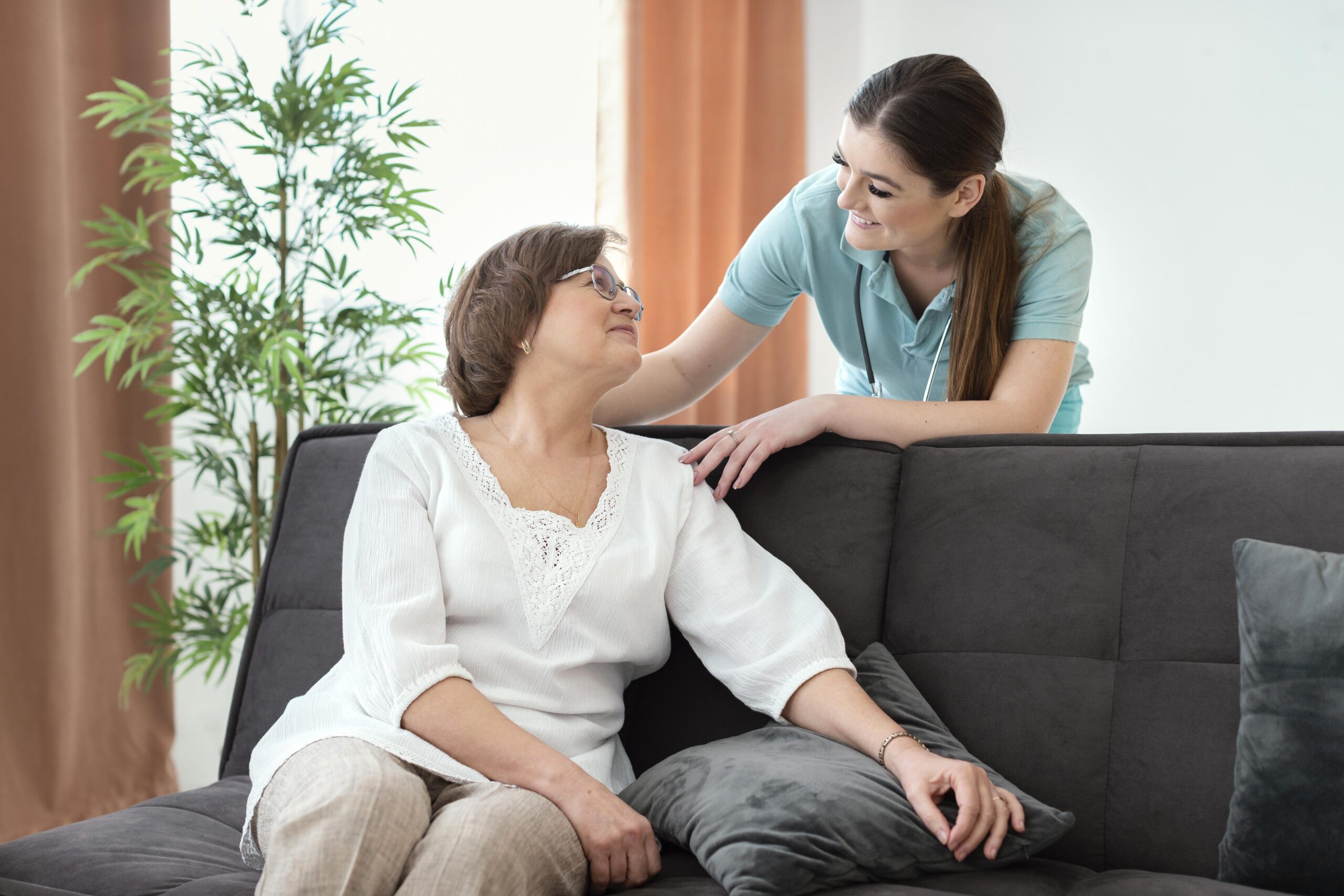 Caregiver providing Alzheimer’s and dementia care support to a senior woman at home in the Tampa Area, FL